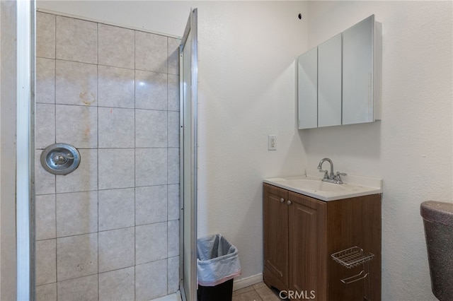 full bathroom with vanity and a shower stall