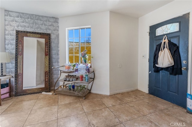 tiled entryway with baseboards