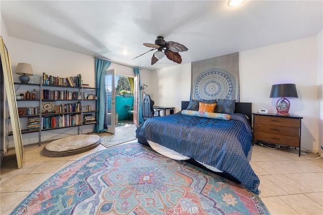 tiled bedroom with ceiling fan