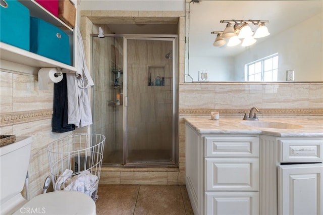 bathroom with vanity, toilet, and a shower stall