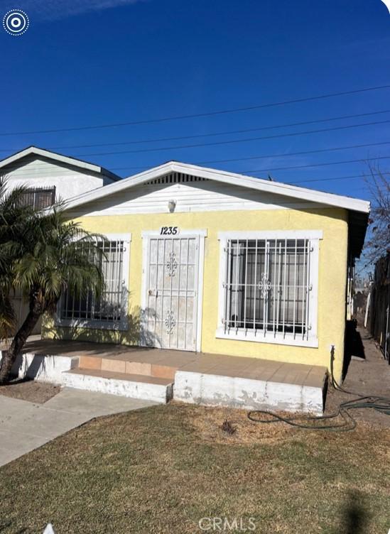 view of side of property featuring stucco siding