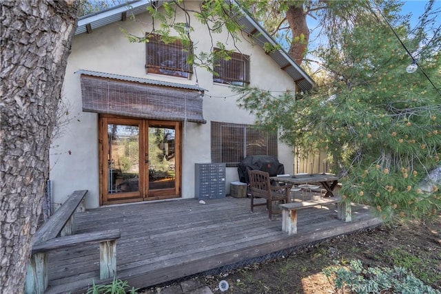 deck with area for grilling and french doors