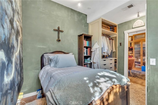 bedroom featuring visible vents