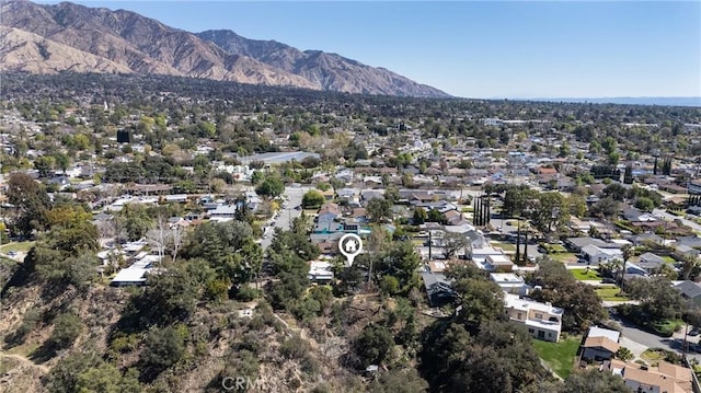 birds eye view of property with a mountain view and a residential view