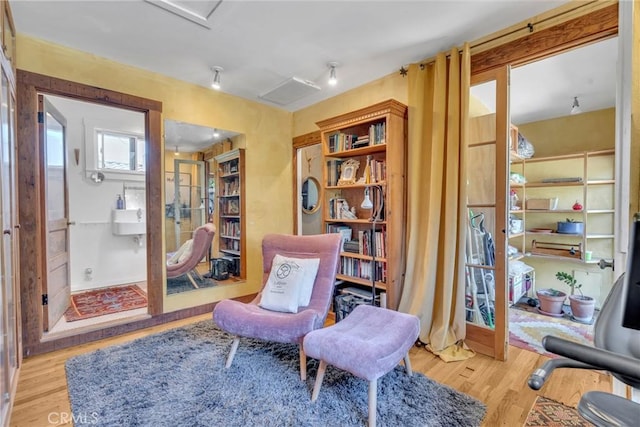 sitting room featuring wood finished floors