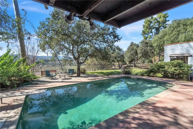 view of pool featuring a patio, fence, and a fenced in pool