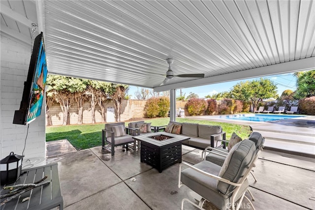 view of patio with an outdoor living space with a fire pit, a fenced backyard, a fenced in pool, and a ceiling fan