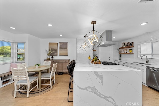 kitchen with gas cooktop, ventilation hood, white cabinetry, a sink, and dishwasher