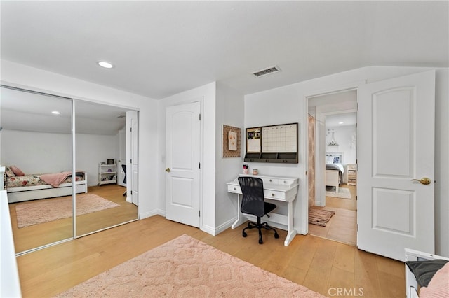 office featuring recessed lighting, visible vents, baseboards, and light wood-style floors