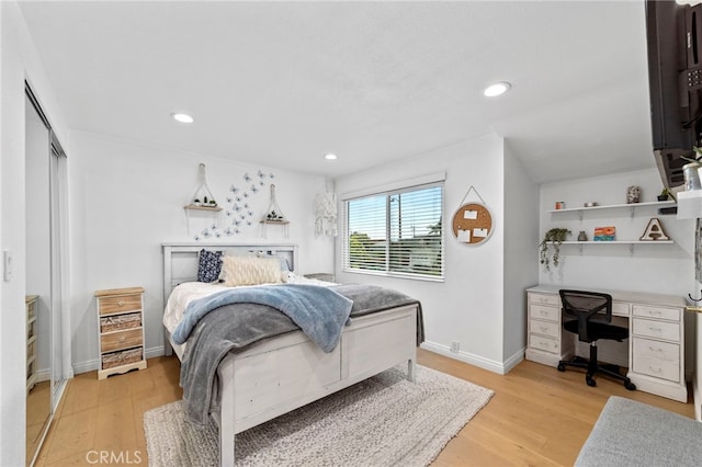 bedroom featuring recessed lighting, baseboards, and light wood finished floors