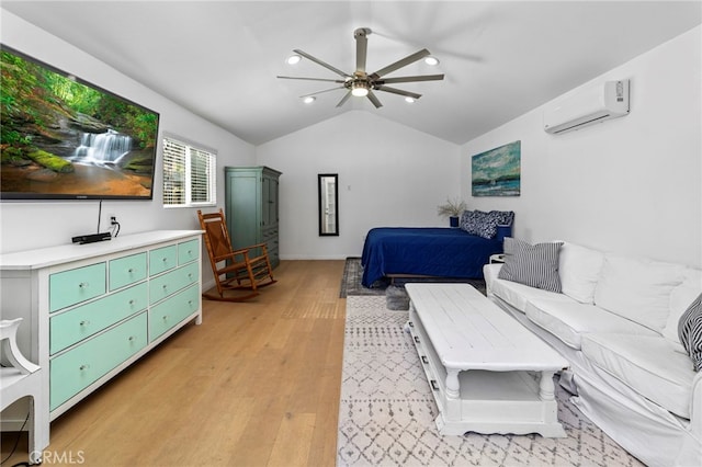 bedroom featuring light wood-type flooring, a wall mounted AC, lofted ceiling, and a ceiling fan