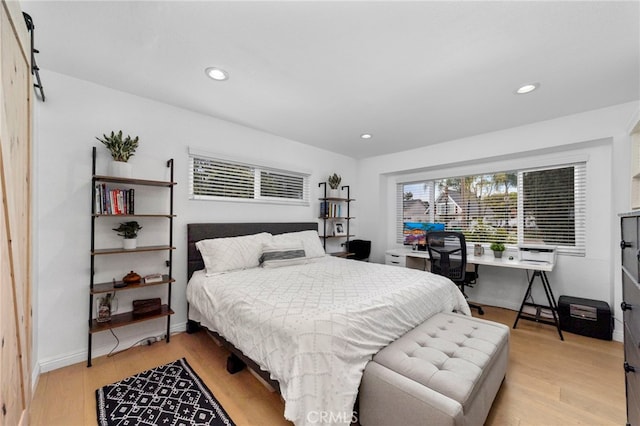 bedroom featuring light wood-style flooring, recessed lighting, and baseboards