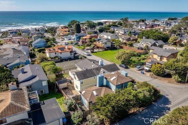 drone / aerial view with a residential view and a water view