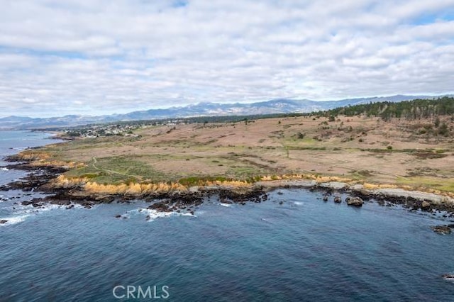 birds eye view of property featuring a water and mountain view