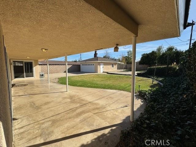 view of patio / terrace featuring an outbuilding