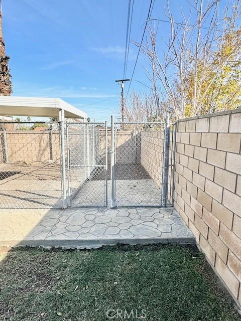 view of gate with fence