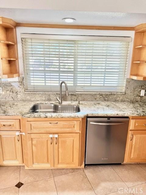 kitchen featuring open shelves, stainless steel dishwasher, light brown cabinets, and a sink