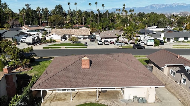 drone / aerial view with a mountain view and a residential view