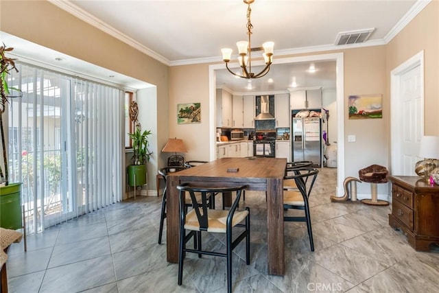 dining area with crown molding, baseboards, visible vents, and a chandelier