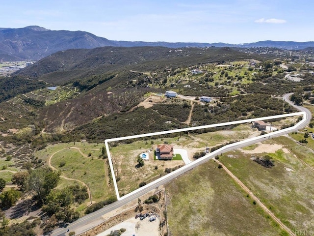 bird's eye view with a mountain view