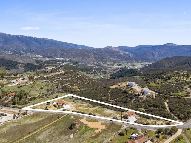 drone / aerial view featuring a mountain view