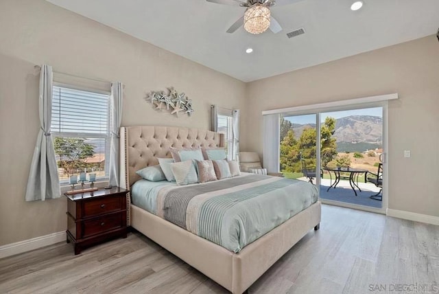 bedroom featuring access to exterior, multiple windows, baseboards, and visible vents