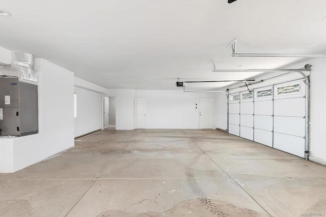 garage with heating unit and a garage door opener