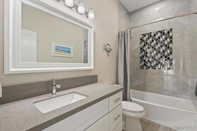 full bathroom with vanity, toilet, and shower / bath combo with shower curtain