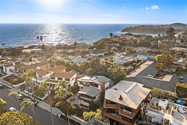 birds eye view of property with a residential view and a water view