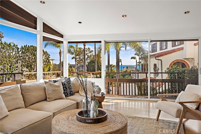 sunroom featuring lofted ceiling