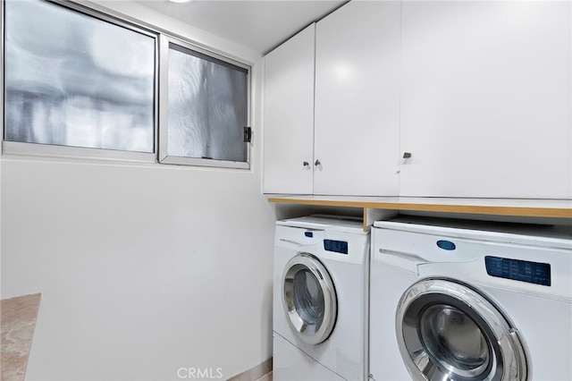 laundry area with cabinet space and washing machine and dryer
