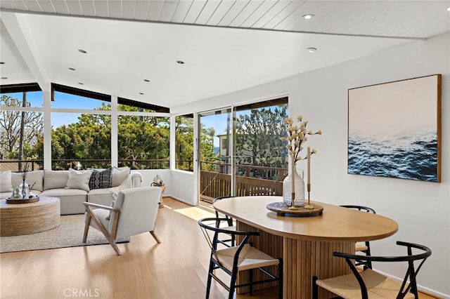 interior space with light wood finished floors, recessed lighting, and lofted ceiling with beams