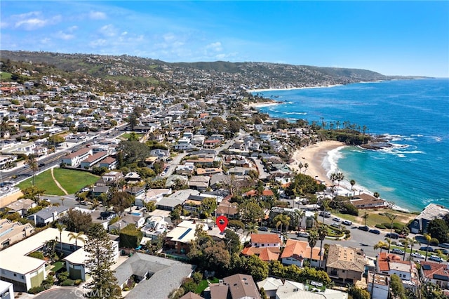 drone / aerial view featuring a residential view and a water view