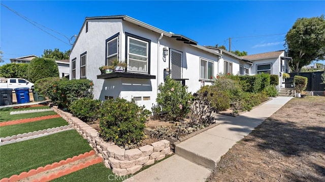 view of side of property with stucco siding