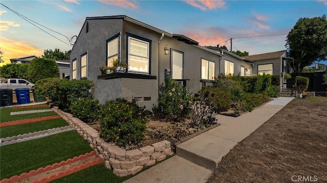 view of side of property with stucco siding