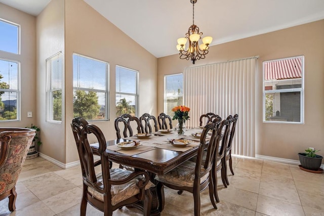 dining area with lofted ceiling, light tile patterned floors, baseboards, and a chandelier