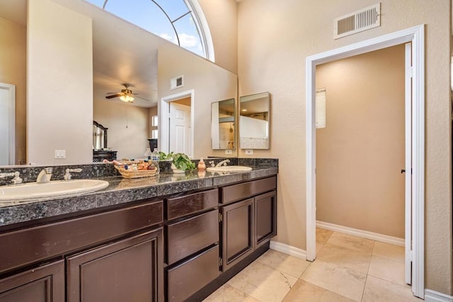 bathroom featuring a sink, visible vents, and double vanity