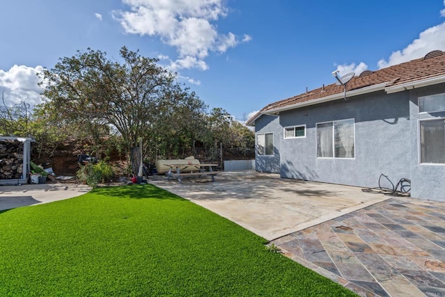 view of yard with a patio area and fence