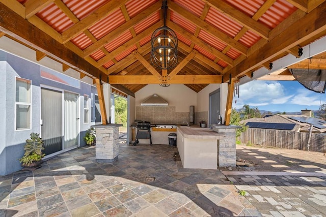 view of patio / terrace featuring a gazebo, area for grilling, and fence