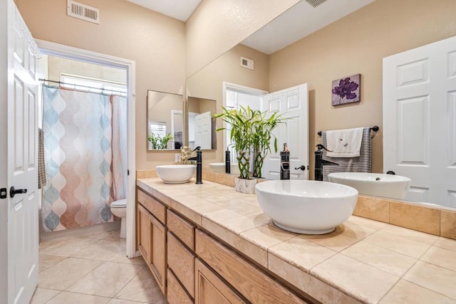 full bathroom with visible vents, toilet, and a sink