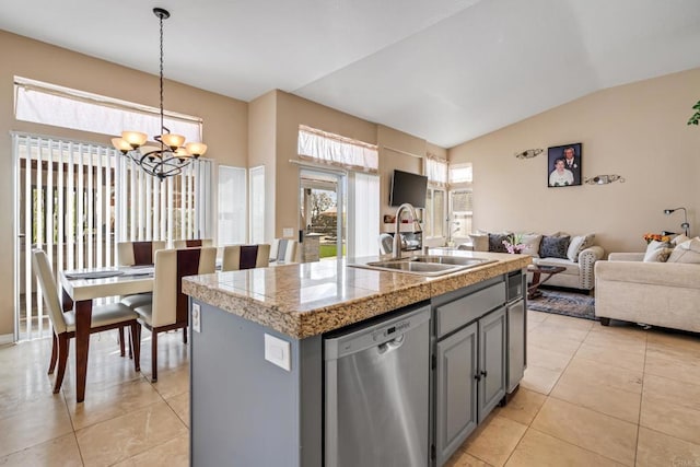 kitchen with gray cabinets, a sink, stainless steel dishwasher, open floor plan, and tile countertops