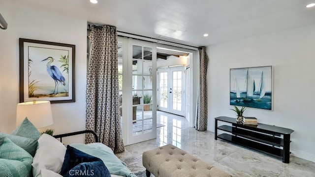 living area with recessed lighting, french doors, marble finish floor, and baseboards