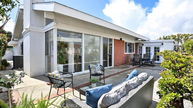 view of patio featuring outdoor lounge area and french doors