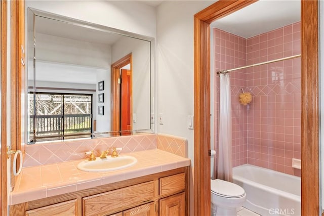 bathroom with tasteful backsplash, shower / bath combo with shower curtain, toilet, and vanity