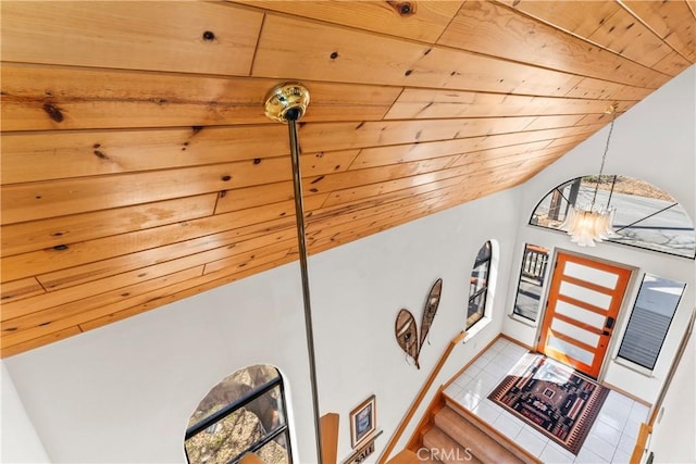 room details with an inviting chandelier, baseboards, and wooden ceiling