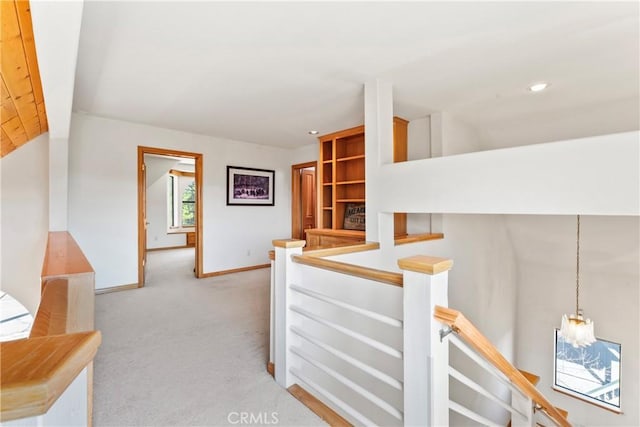 hall featuring an upstairs landing, recessed lighting, baseboards, light colored carpet, and vaulted ceiling