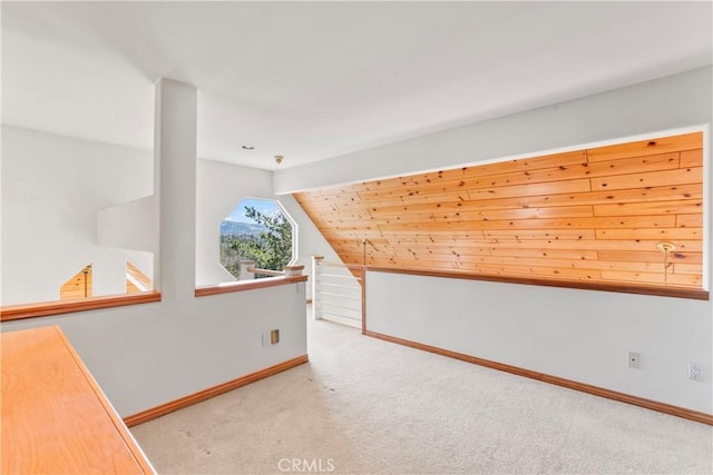 bonus room featuring baseboards, lofted ceiling, and carpet