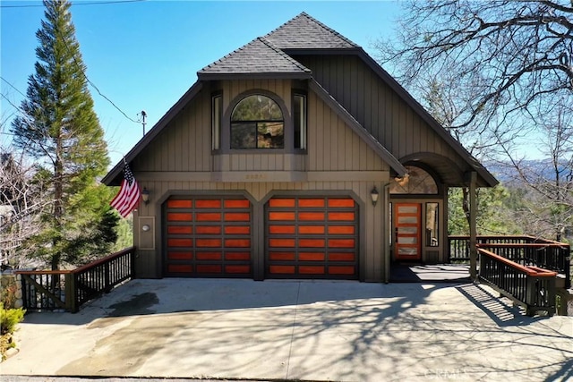 garage with concrete driveway