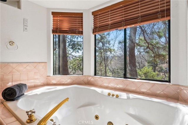 full bathroom featuring a whirlpool tub