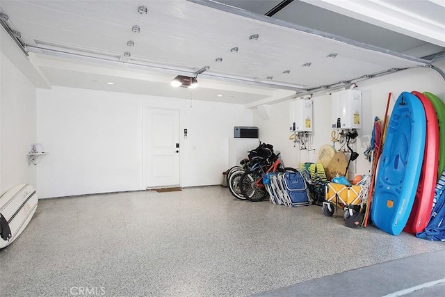 garage featuring tankless water heater and a garage door opener